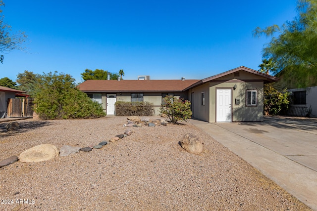 ranch-style home featuring a patio area