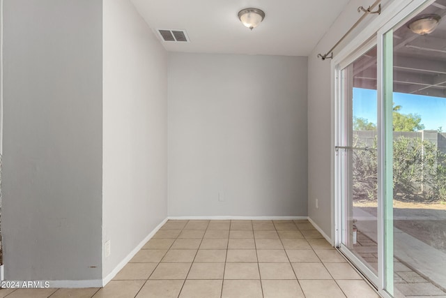 spare room with light tile patterned floors