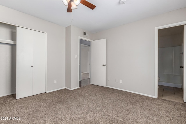 unfurnished bedroom with carpet floors, ensuite bathroom, and ceiling fan