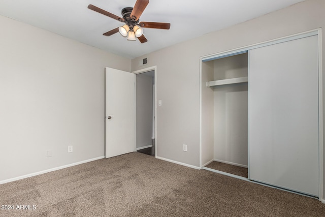 unfurnished bedroom featuring ceiling fan, carpet floors, and a closet