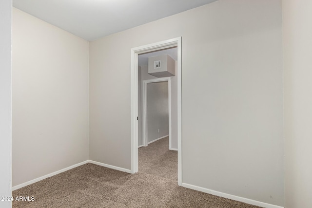 unfurnished room featuring carpet flooring