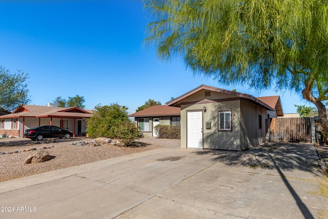 single story home featuring a carport