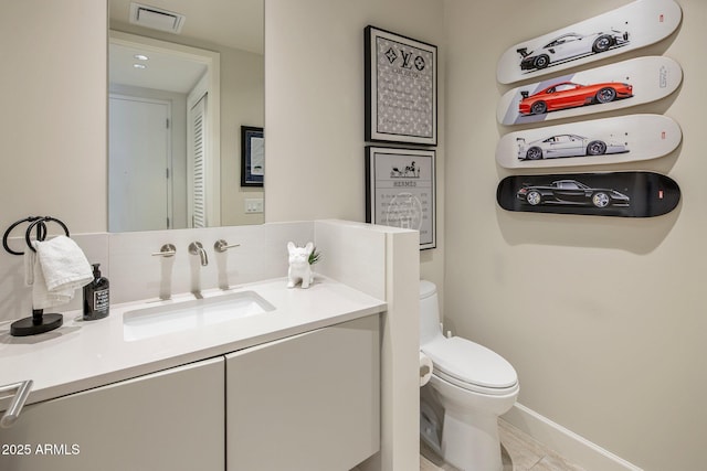15215 N Kierland Blvd Unit 101, Scottsdale, AZ 85254 - half bathroom with vanity and tile patterned flooring