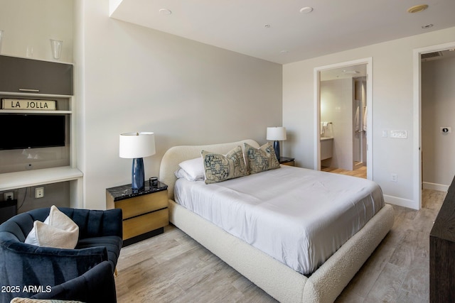 15215 N Kierland Blvd Unit 101, Scottsdale, AZ 85254 - bedroom with light wood-type flooring and baseboards