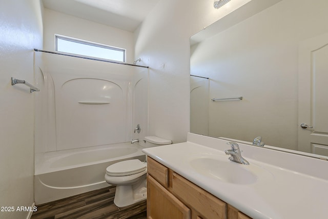 bathroom with bathing tub / shower combination, vanity, toilet, and wood finished floors