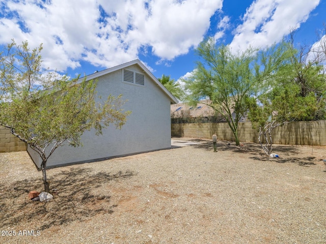 10613 S 41st Pl, Phoenix, AZ 85044 - view of side of home featuring stucco siding and a fenced backyard