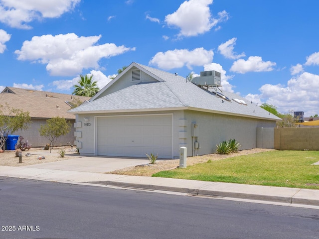 10613 S 41st Pl, Phoenix, AZ 85044 - view of front facade with a shingled roof, stucco siding, concrete driveway, and a garage