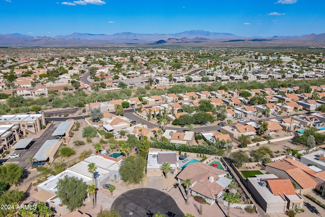 birds eye view of property featuring a mountain view