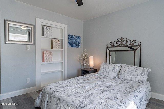 bedroom featuring dark hardwood / wood-style flooring and ceiling fan