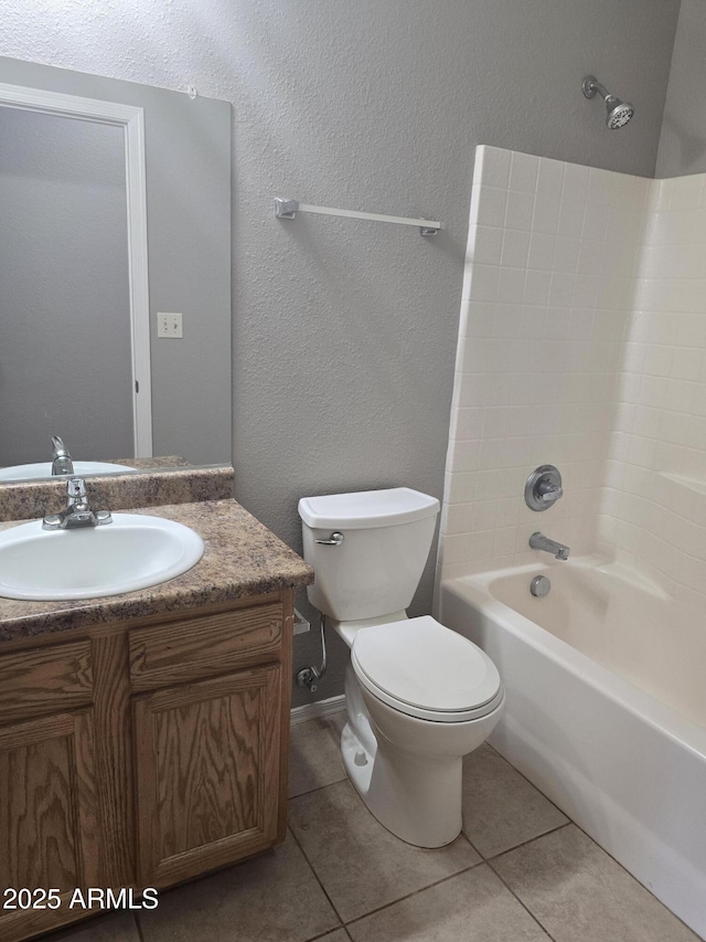 full bathroom with vanity, tile patterned floors, toilet, and shower / bath combination