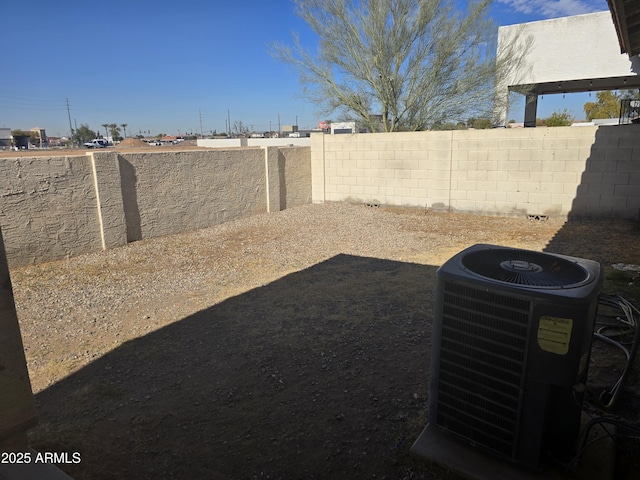 view of yard with central air condition unit