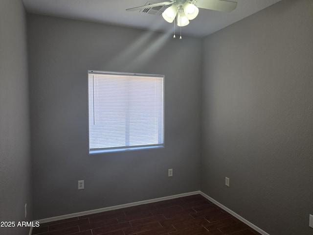 spare room with ceiling fan