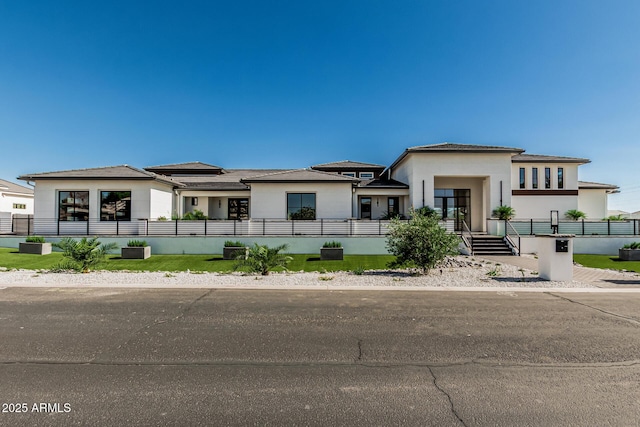 3653 E Runaway Bay Pl, Queen Creek, AZ 85142 - prairie-style house featuring a fenced front yard and stucco siding