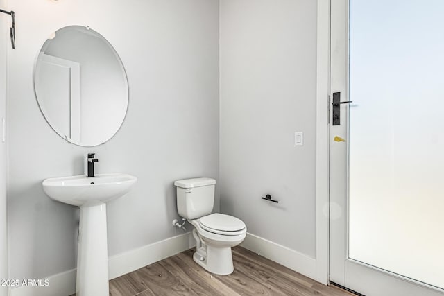 3653 E Runaway Bay Pl, Queen Creek, AZ 85142 - bathroom with toilet, wood finished floors, baseboards, and a sink