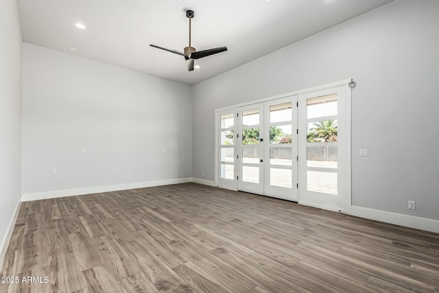 3653 E Runaway Bay Pl, Queen Creek, AZ 85142 - spare room featuring a ceiling fan, wood finished floors, baseboards, and recessed lighting