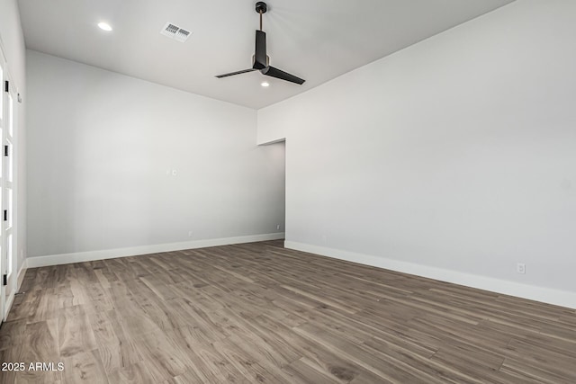 3653 E Runaway Bay Pl, Queen Creek, AZ 85142 - spare room with ceiling fan, wood finished floors, baseboards, and recessed lighting