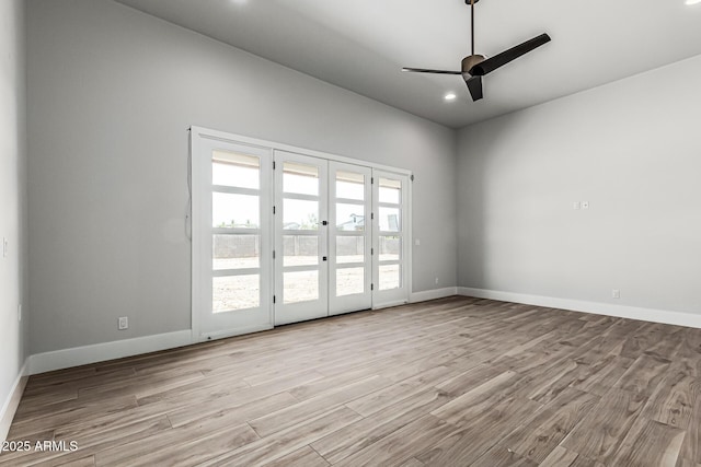 3653 E Runaway Bay Pl, Queen Creek, AZ 85142 - unfurnished room with a ceiling fan, french doors, recessed lighting, baseboards, and wood finished floors