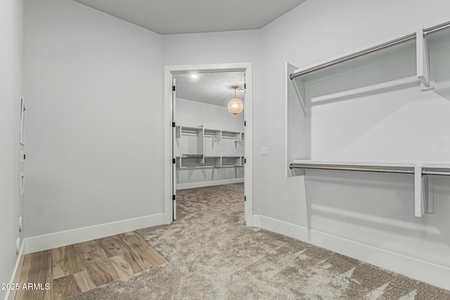 3653 E Runaway Bay Pl, Queen Creek, AZ 85142 - walk in closet with wood finished floors