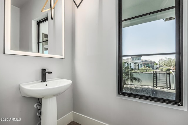 3653 E Runaway Bay Pl, Queen Creek, AZ 85142 - bathroom featuring baseboards
