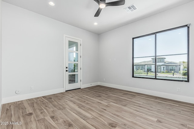 3653 E Runaway Bay Pl, Queen Creek, AZ 85142 - empty room with healthy amount of natural light, wood finished floors, baseboards, recessed lighting, and a ceiling fan