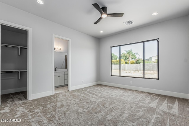 3653 E Runaway Bay Pl, Queen Creek, AZ 85142 - unfurnished bedroom featuring carpet, a spacious closet, baseboards, recessed lighting, and ensuite bath