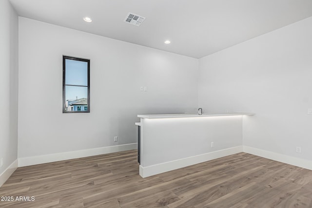 3653 E Runaway Bay Pl, Queen Creek, AZ 85142 - empty room featuring recessed lighting, wood finished floors, and baseboards
