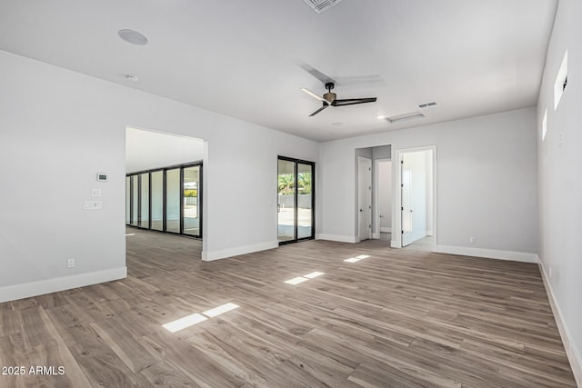 3653 E Runaway Bay Pl, Queen Creek, AZ 85142 - spare room featuring baseboards, wood finished floors, and ceiling fan