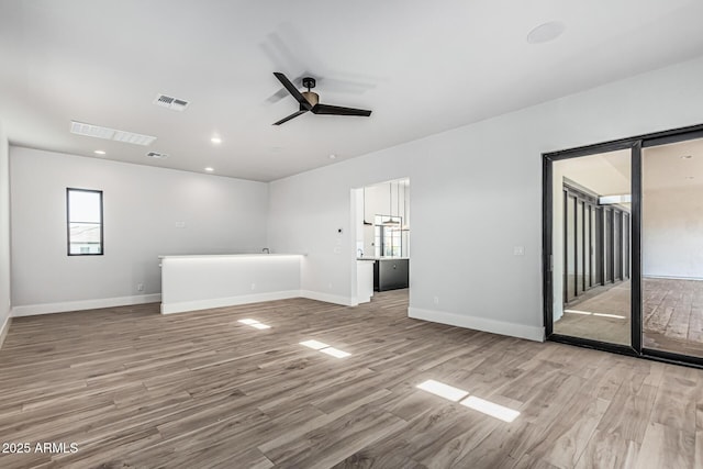 3653 E Runaway Bay Pl, Queen Creek, AZ 85142 - spare room featuring wood finished floors, a ceiling fan, baseboards, and recessed lighting