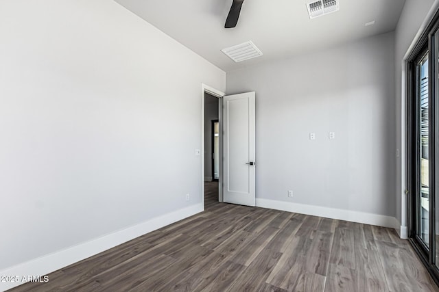 3653 E Runaway Bay Pl, Queen Creek, AZ 85142 - unfurnished room with a ceiling fan, dark wood finished floors, and baseboards