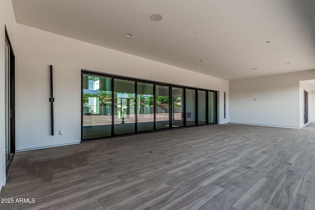 3653 E Runaway Bay Pl, Queen Creek, AZ 85142 - empty room with wood finished floors