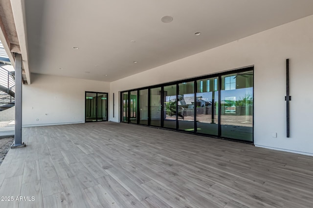 3653 E Runaway Bay Pl, Queen Creek, AZ 85142 - empty room featuring wood finished floors and baseboards