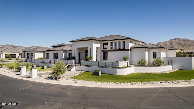 3653 E Runaway Bay Pl, Queen Creek, AZ 85142 - prairie-style house featuring stucco siding, a mountain view, a front yard, and a residential view