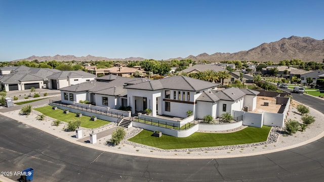 3653 E Runaway Bay Pl, Queen Creek, AZ 85142 - contemporary house with a residential view, a mountain view, stucco siding, and a tiled roof