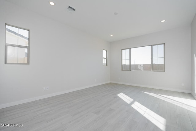 unfurnished room with light hardwood / wood-style floors