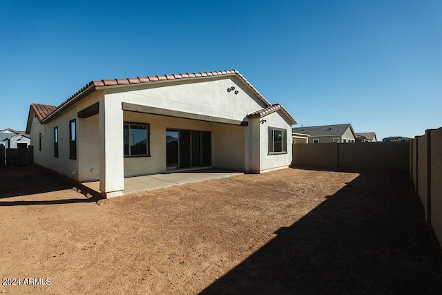 back of property with a patio area