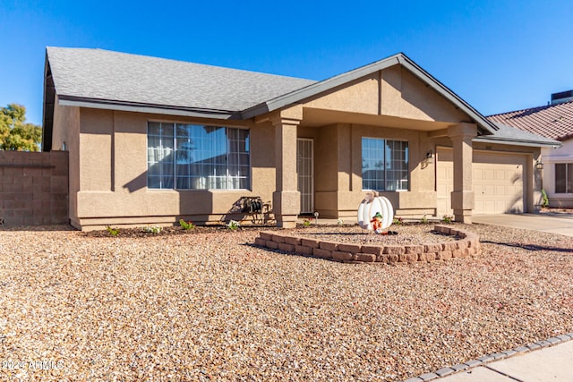 ranch-style home featuring a garage