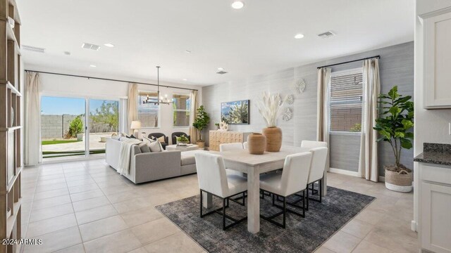 dining space featuring recessed lighting, visible vents, an inviting chandelier, and light tile patterned floors