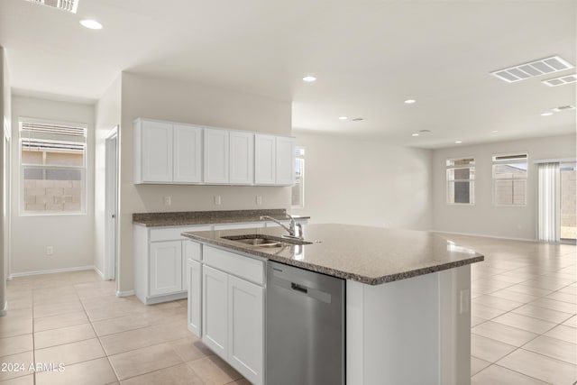 kitchen featuring a sink, dishwasher, open floor plan, light tile patterned floors, and visible vents