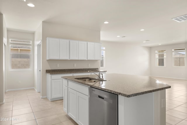 kitchen with visible vents, dishwasher, white cabinetry, a sink, and light tile patterned floors