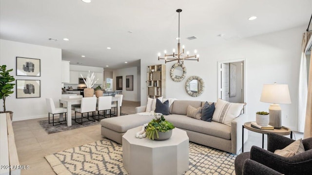 living room featuring recessed lighting, a notable chandelier, and visible vents