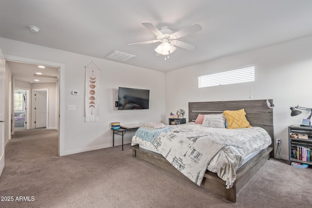 bedroom with multiple windows, baseboards, and carpet