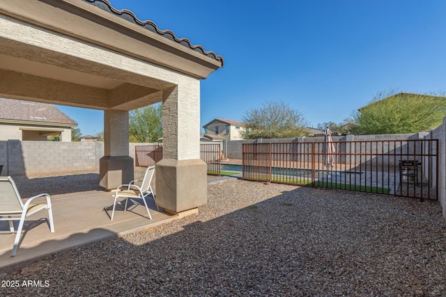 view of yard with a fenced backyard and a patio area