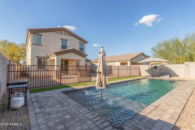 view of pool featuring a fenced in pool, a fenced backyard, and a patio area