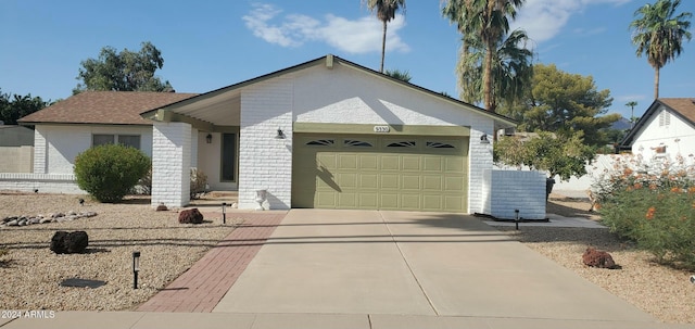 ranch-style home featuring a garage