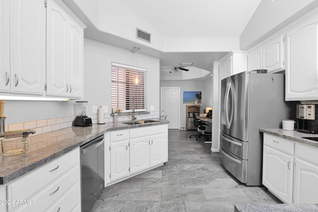 kitchen featuring sink, white cabinets, lofted ceiling, appliances with stainless steel finishes, and ceiling fan