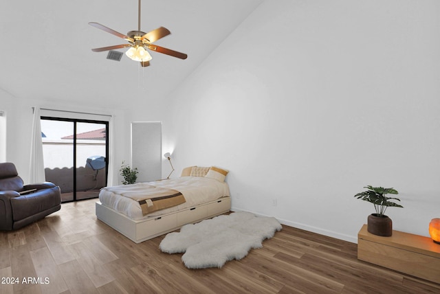 bedroom featuring high vaulted ceiling, wood-type flooring, ceiling fan, and access to exterior