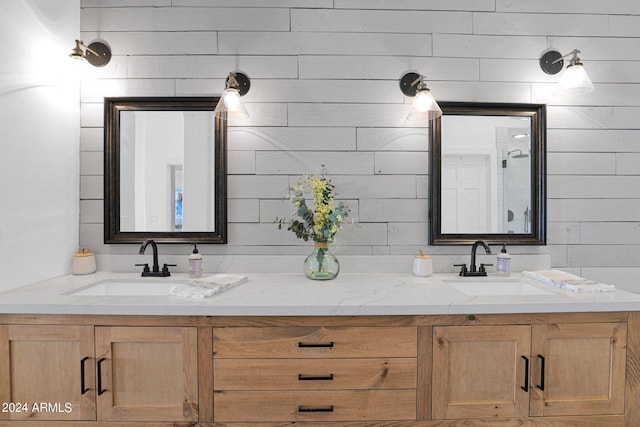 bathroom featuring wood walls and vanity