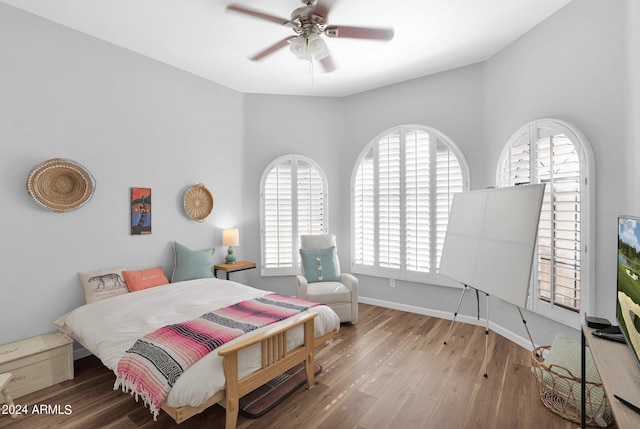 bedroom featuring ceiling fan and hardwood / wood-style floors