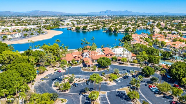 birds eye view of property featuring a water and mountain view