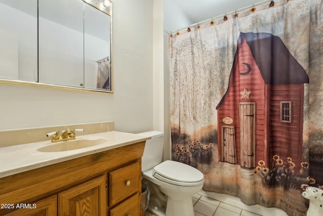 bathroom featuring tile patterned floors, vanity, and toilet